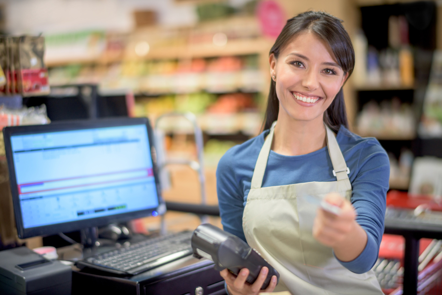 Cashier at the supermarket getting a card payment